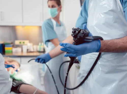 Gastroenterologist performing endoscopy procedure representing streamlined GI medical billing and revenue cycle optimization.
